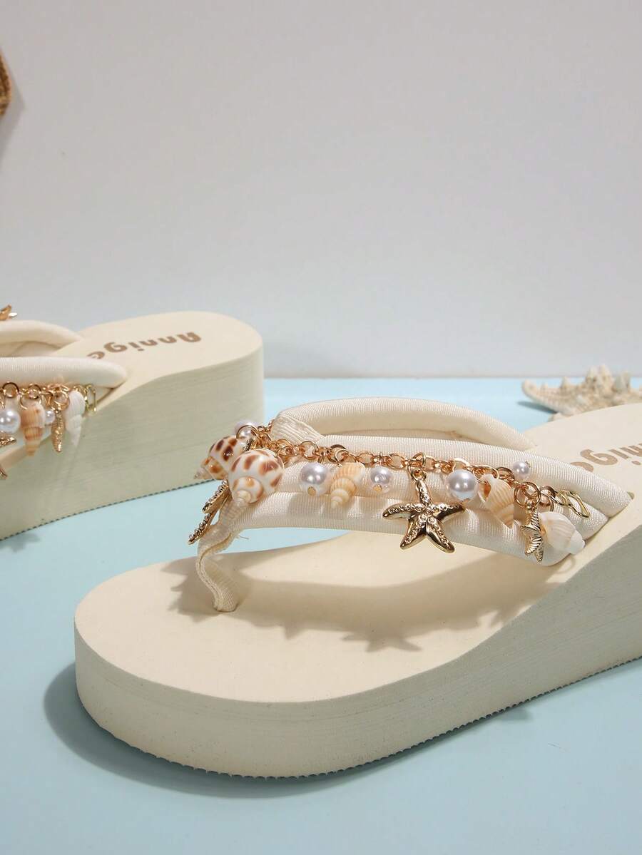 Beige platform wedge flip flop slippers featuring decorative chain and shell details with EVA sole for women.