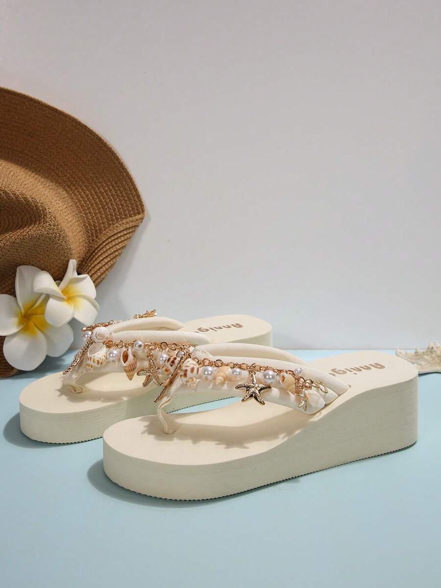 Beige platform wedge flip flop slippers featuring decorative chain and shell details with EVA sole for women.
