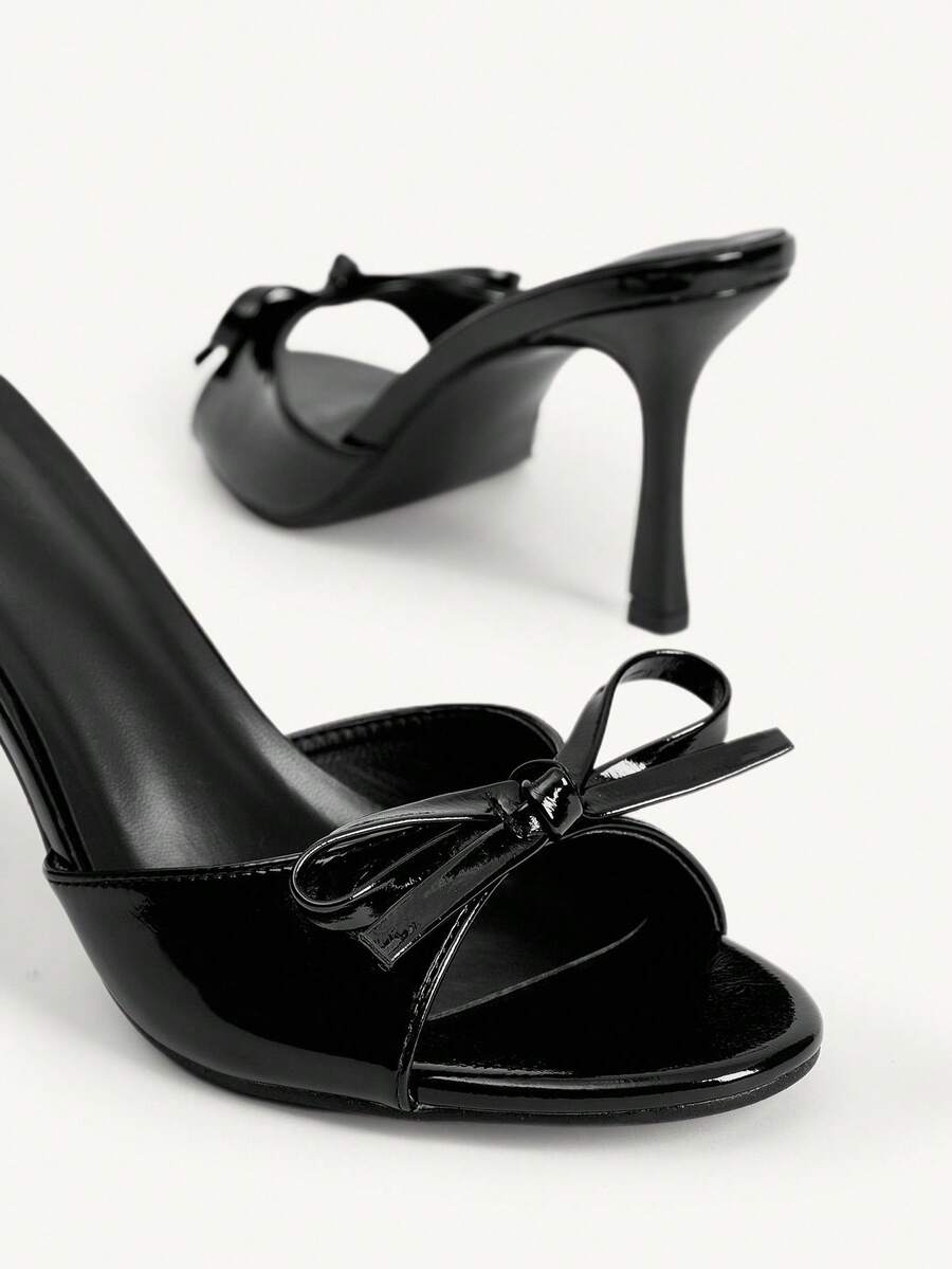 Women's black open-toe stiletto mule high heel sandals with bow detail
