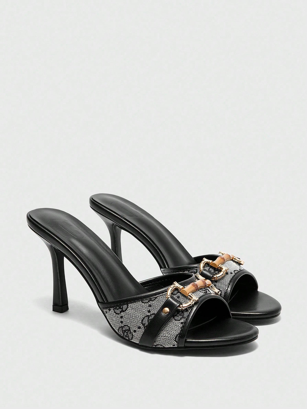 Women's open toe high heel slingback sandals featuring metal bamboo joint accent and stiletto heels.