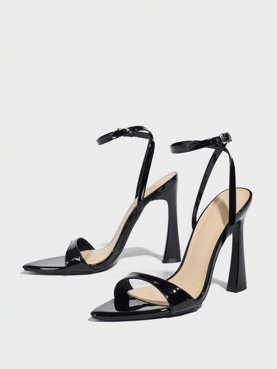 Burgundy open-toe high heels featuring an adjustable ankle strap with buckle closure and high stiletto heel.