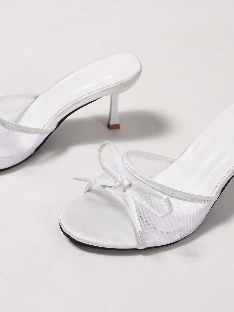 Women's black open toe mesh slide sandals with bowknot detail and stiletto heels