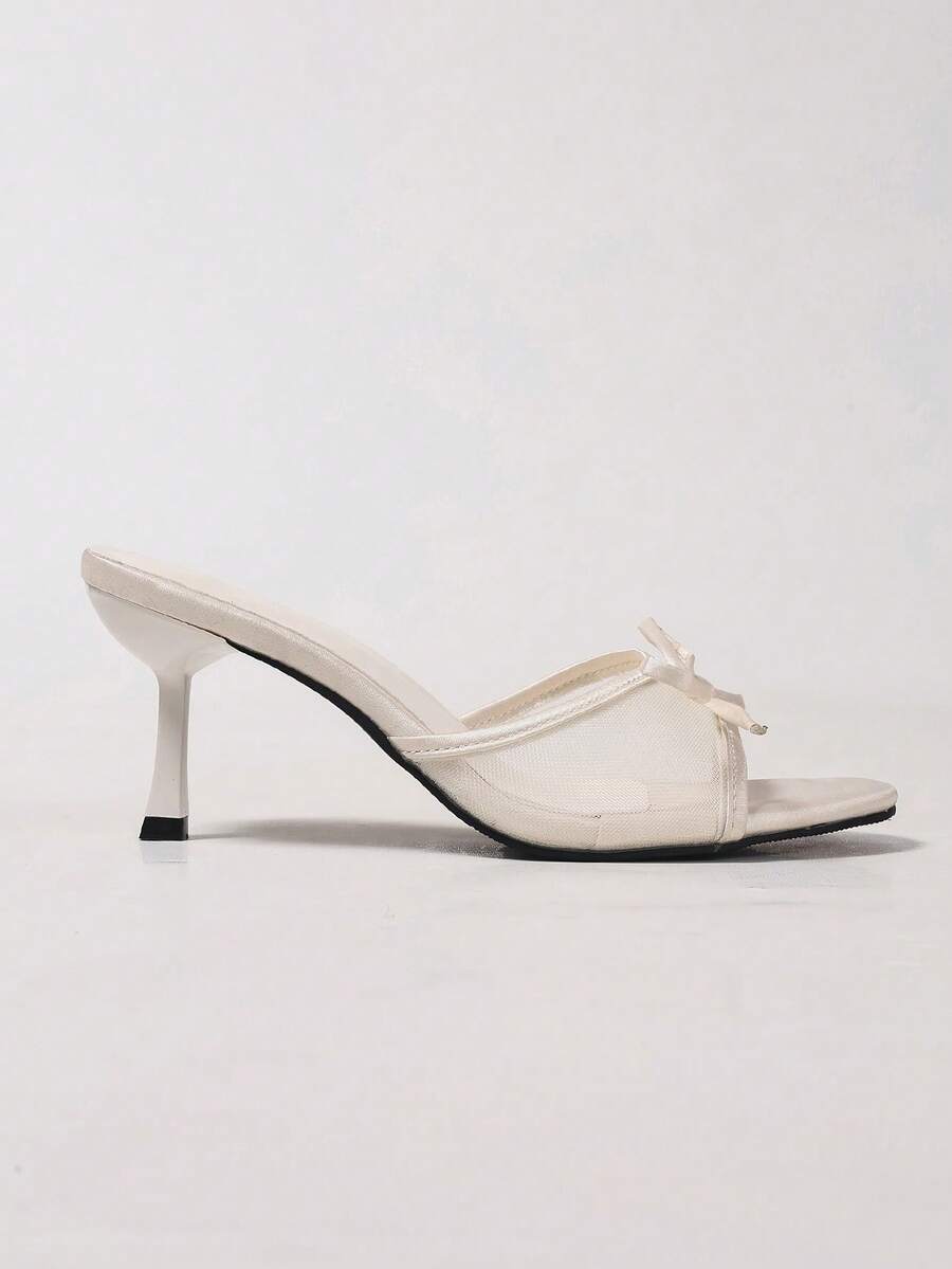 Women's black open toe mesh slide sandals with bowknot detail and stiletto heels