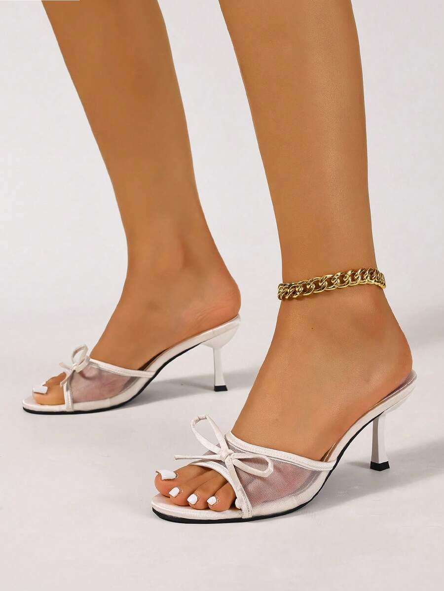Women's black open toe mesh slide sandals with bowknot detail and stiletto heels