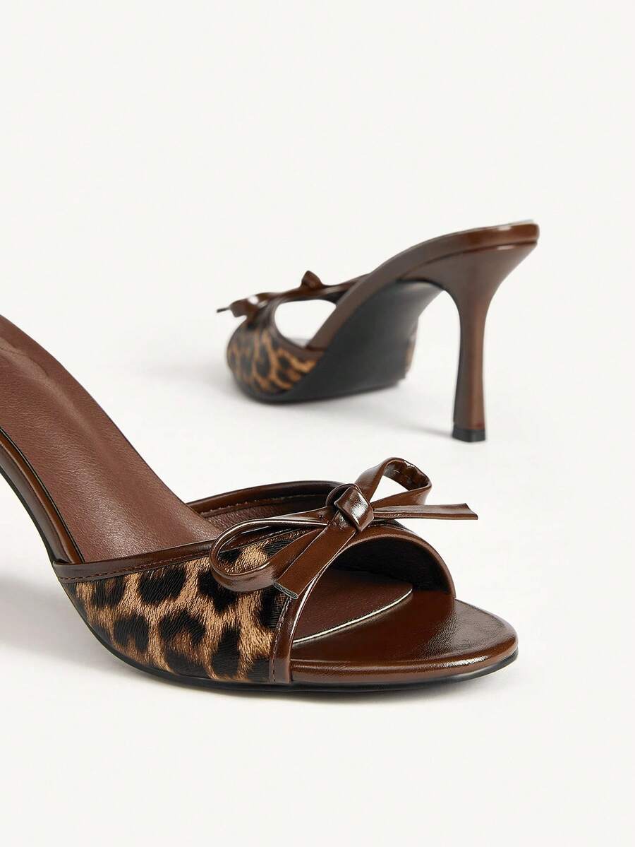 Women's black open-toe stiletto mule high heel sandals with bow detail