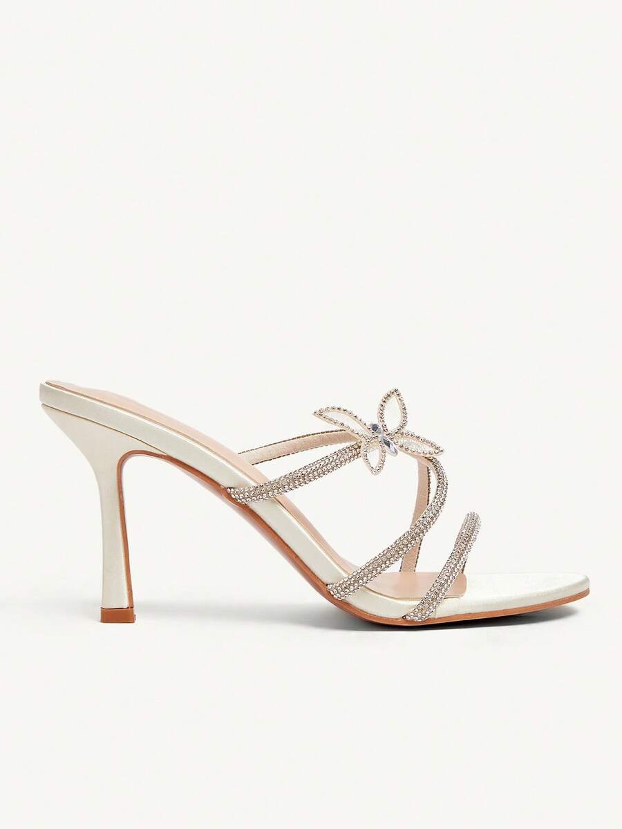 Butterfly high heel sandals featuring crystal embellished ankle straps, open toe design, and sleek stiletto heels for wedding and party wear.