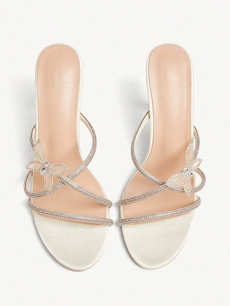 Butterfly high heel sandals featuring crystal embellished ankle straps, open toe design, and sleek stiletto heels for wedding and party wear.