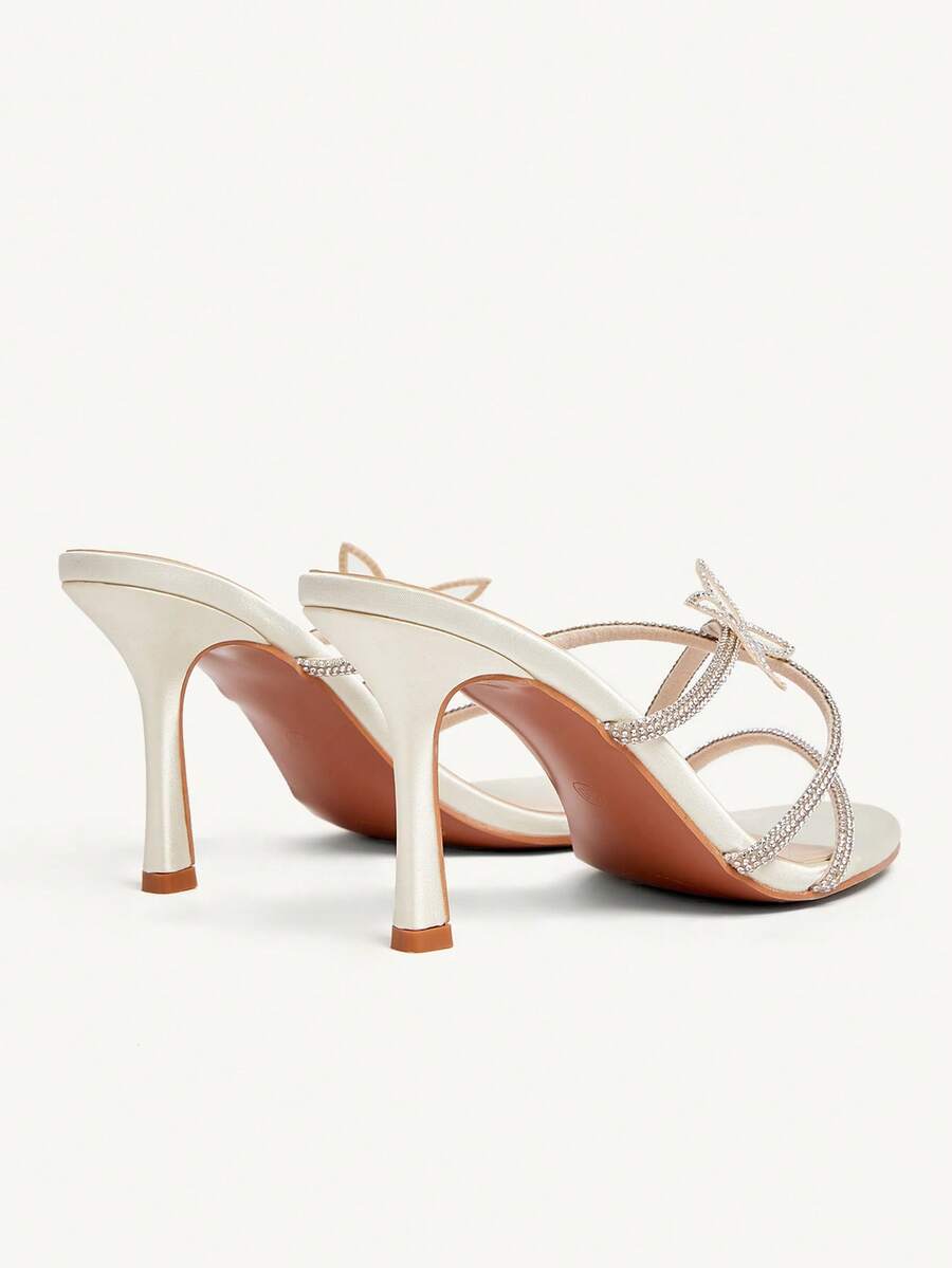 Butterfly high heel sandals featuring crystal embellished ankle straps, open toe design, and sleek stiletto heels for wedding and party wear.