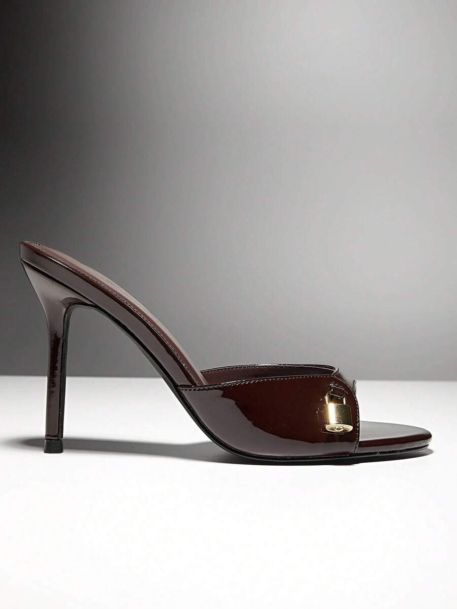Women's pointed toe stiletto high heel wedding shoes featuring an elegant silhouette and glossy finish.