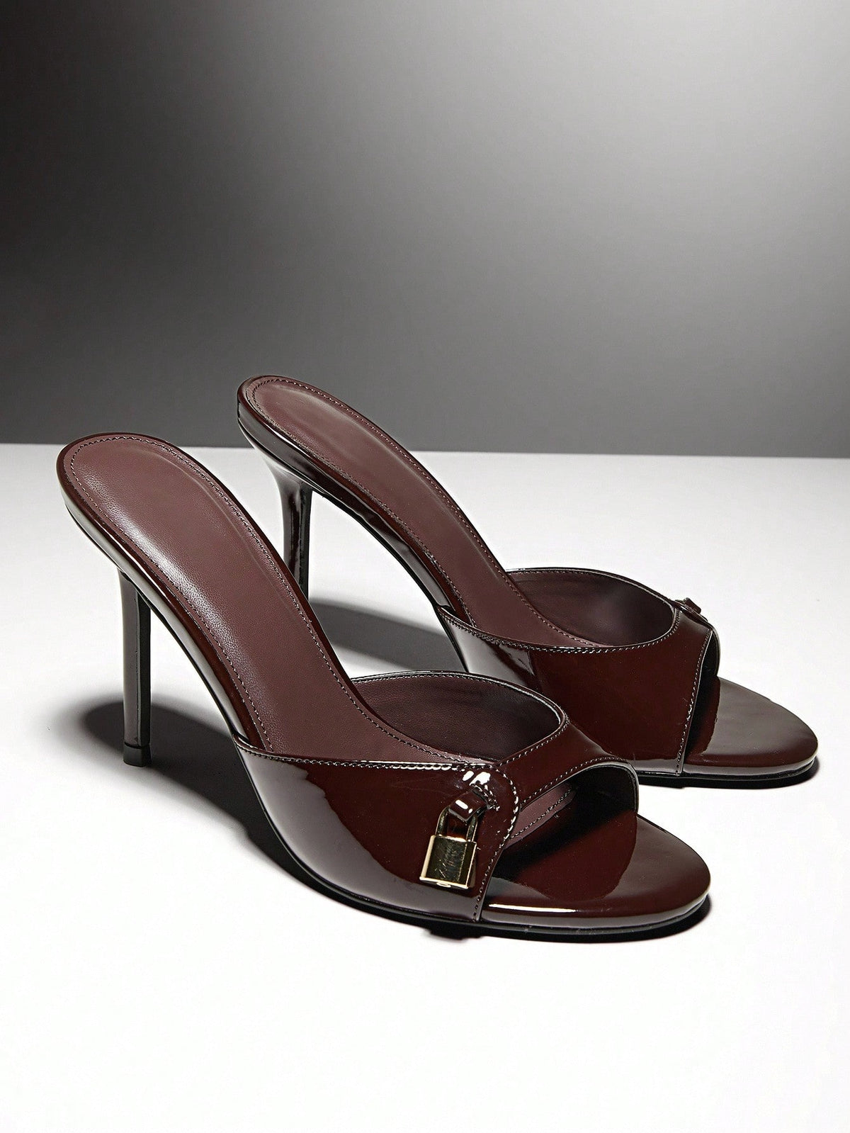 Women's pointed toe stiletto high heel wedding shoes featuring an elegant silhouette and glossy finish.