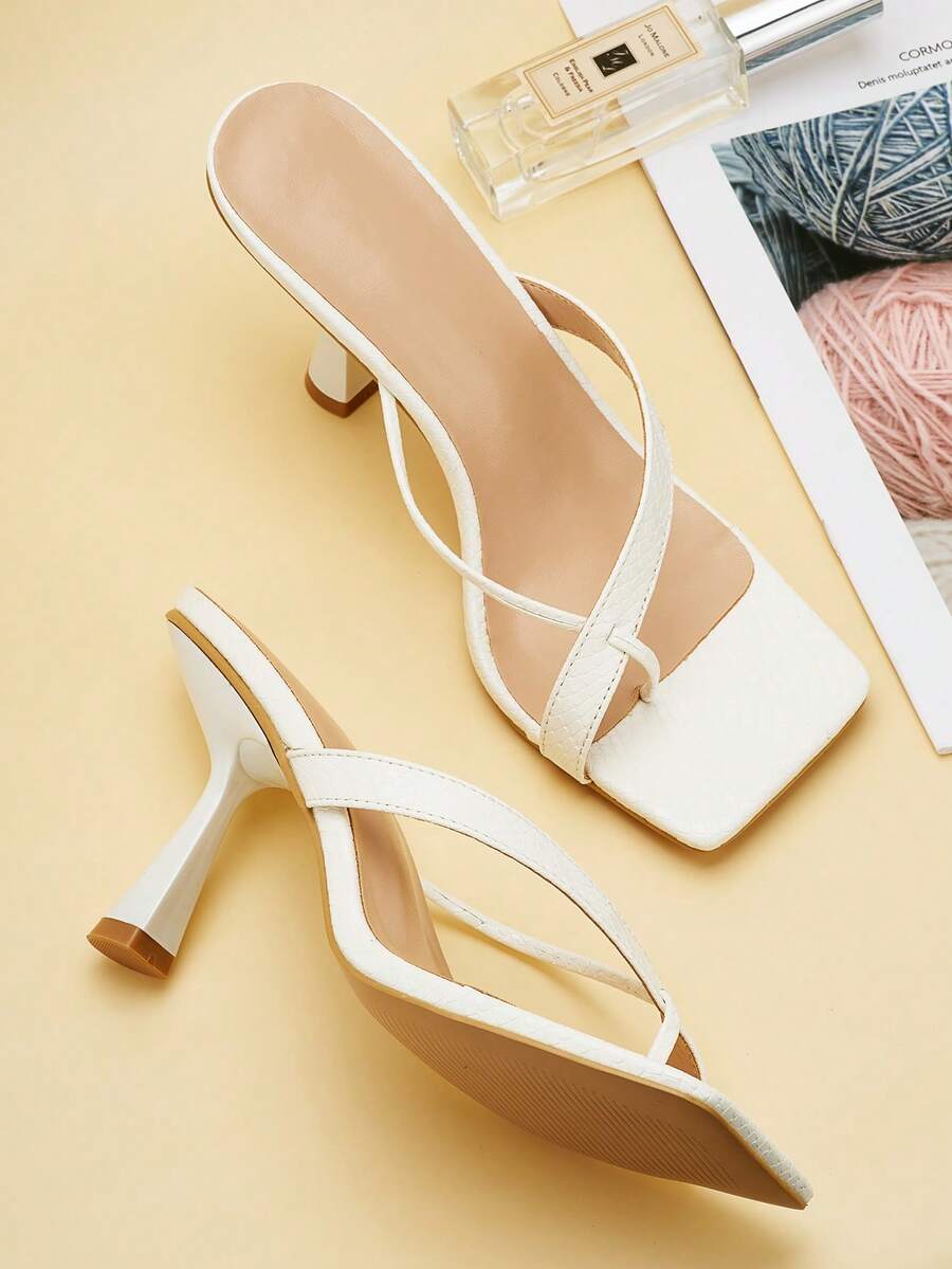 Women's yellow open toe high-heeled sandals with stiletto heel and slip-on mule design