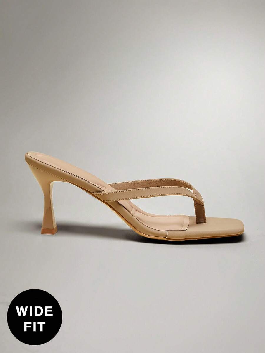 Women's square toe kitten heel thong heeled sandals featuring an asymmetrical strap design and mid heel