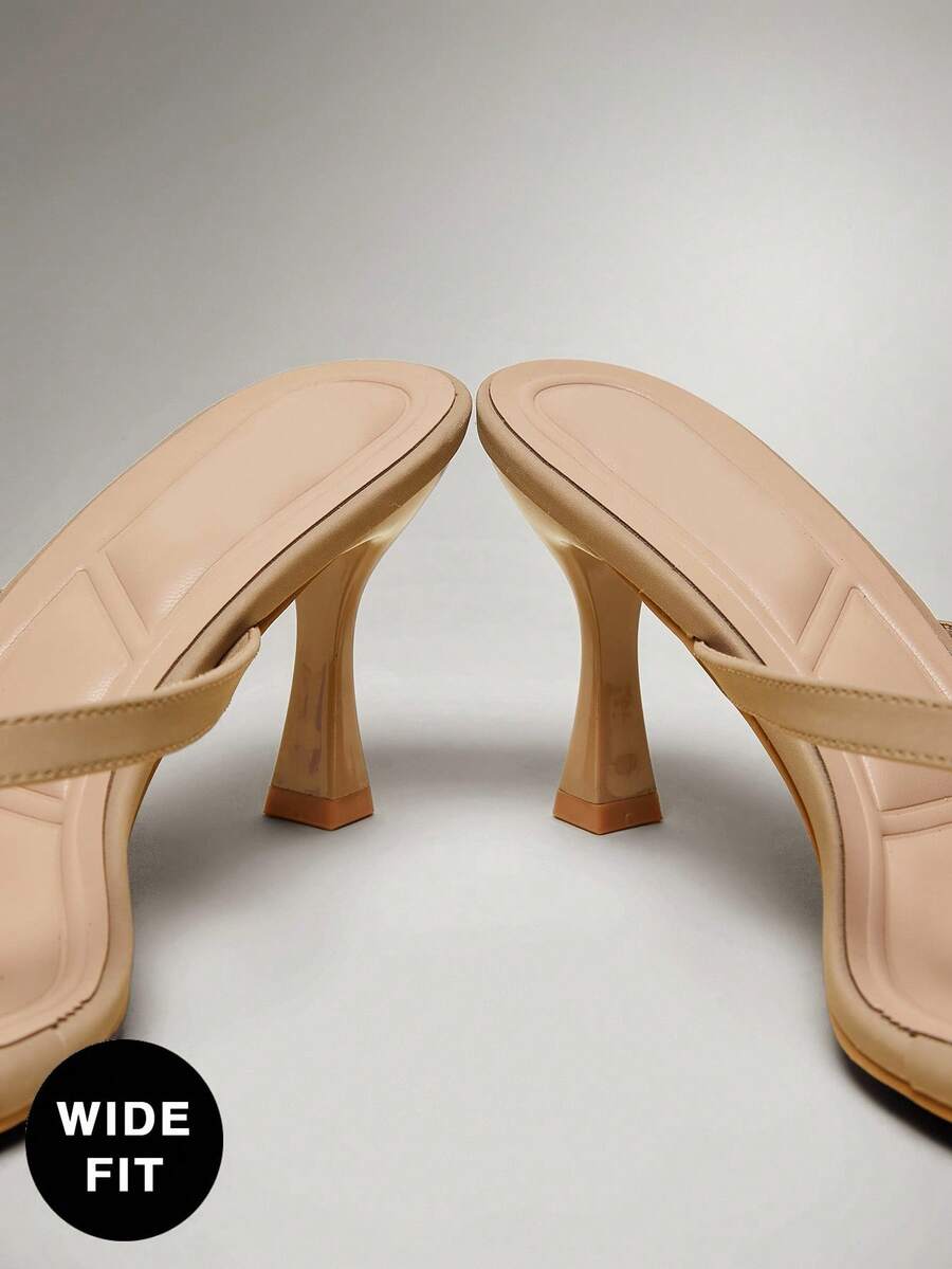 Women's square toe kitten heel thong heeled sandals featuring an asymmetrical strap design and mid heel