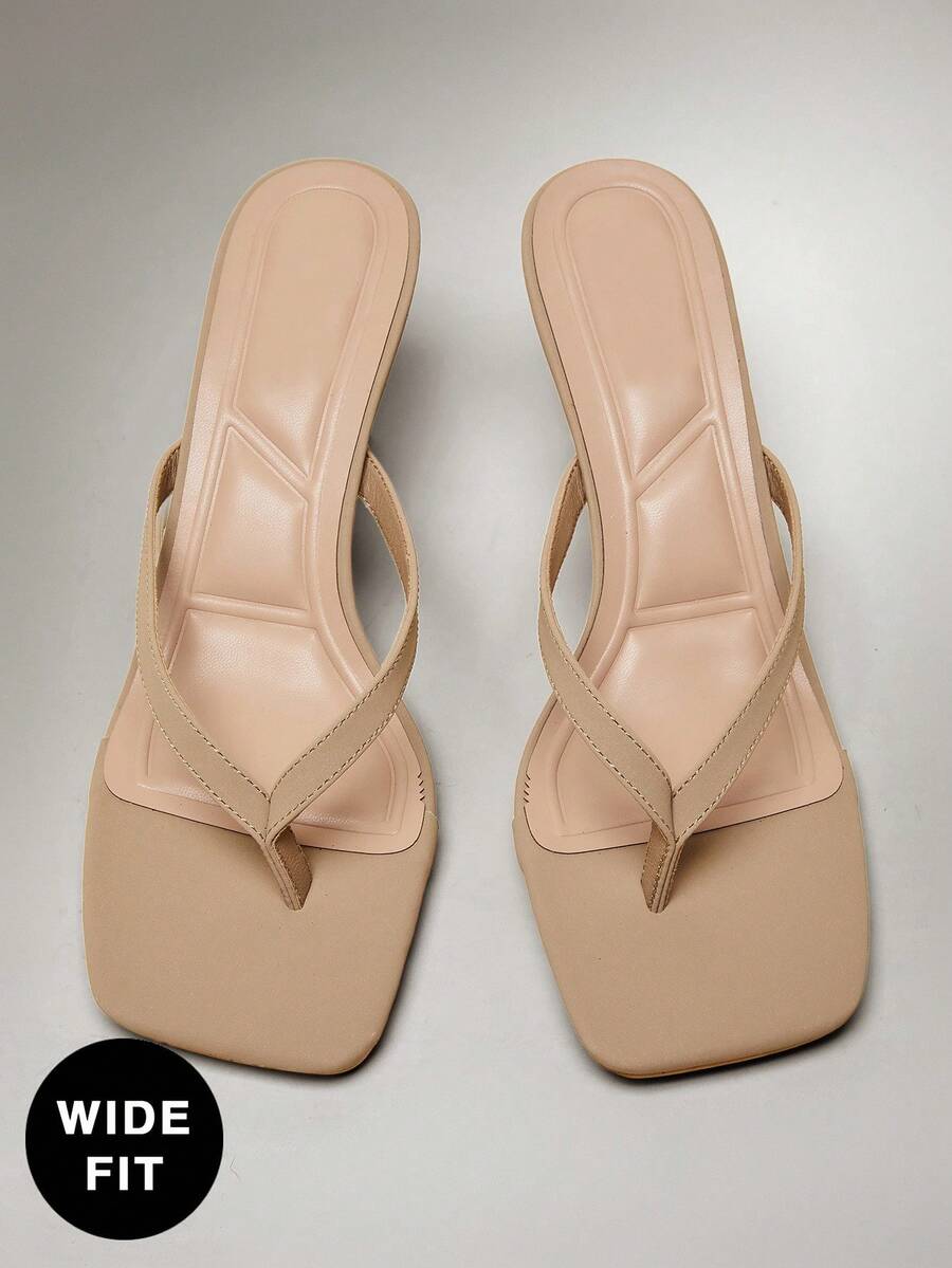 Women's square toe kitten heel thong heeled sandals featuring an asymmetrical strap design and mid heel