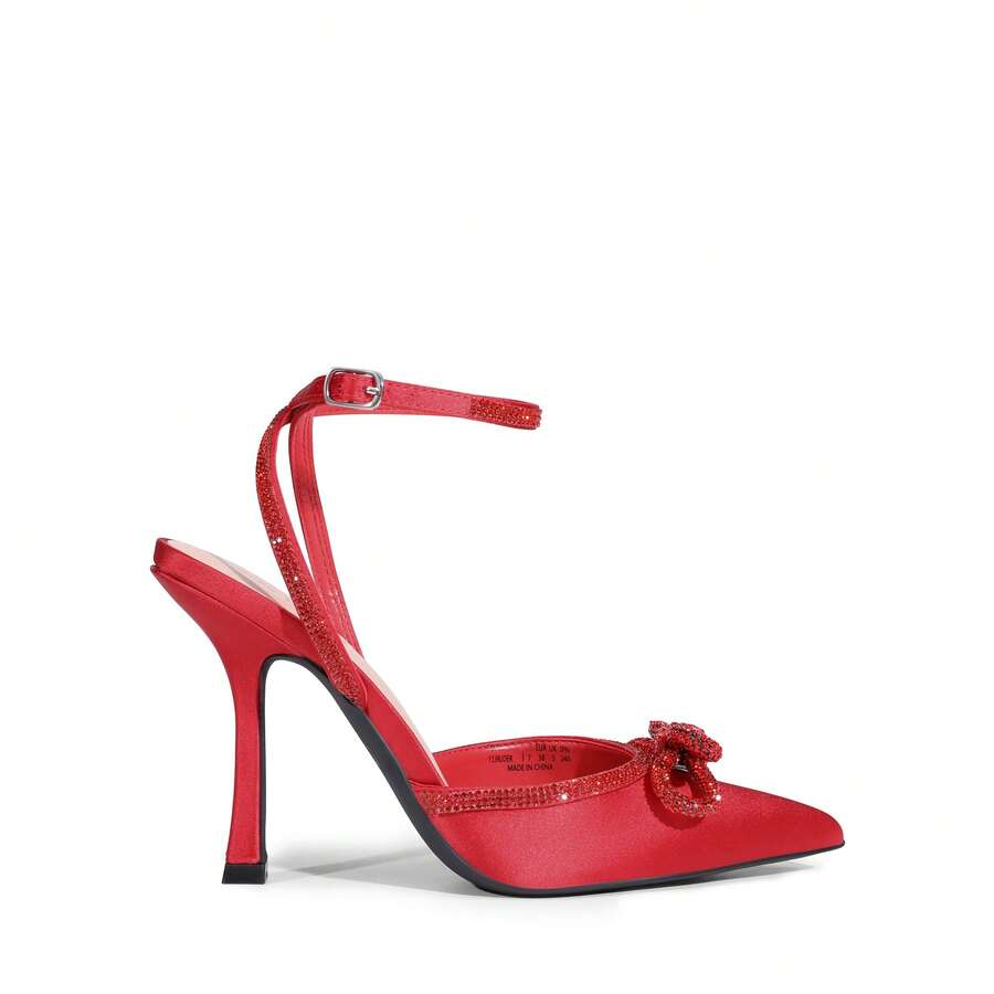 Women's rhinestone ankle strap high heels with pointed closed toe, strappy bow details, and stiletto heel for wedding and prom wear.