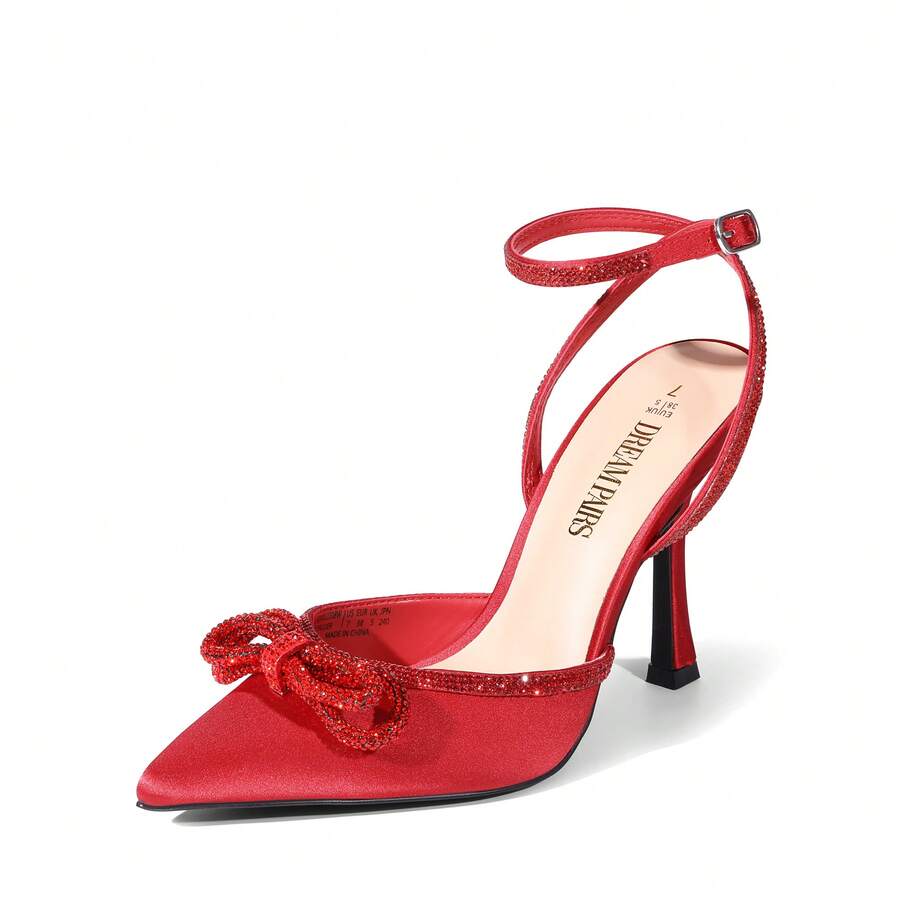 Women's rhinestone ankle strap high heels with pointed closed toe, strappy bow details, and stiletto heel for wedding and prom wear.