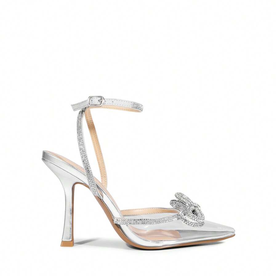 Women's rhinestone ankle strap high heels with pointed closed toe, strappy bow details, and stiletto heel for wedding and prom wear.