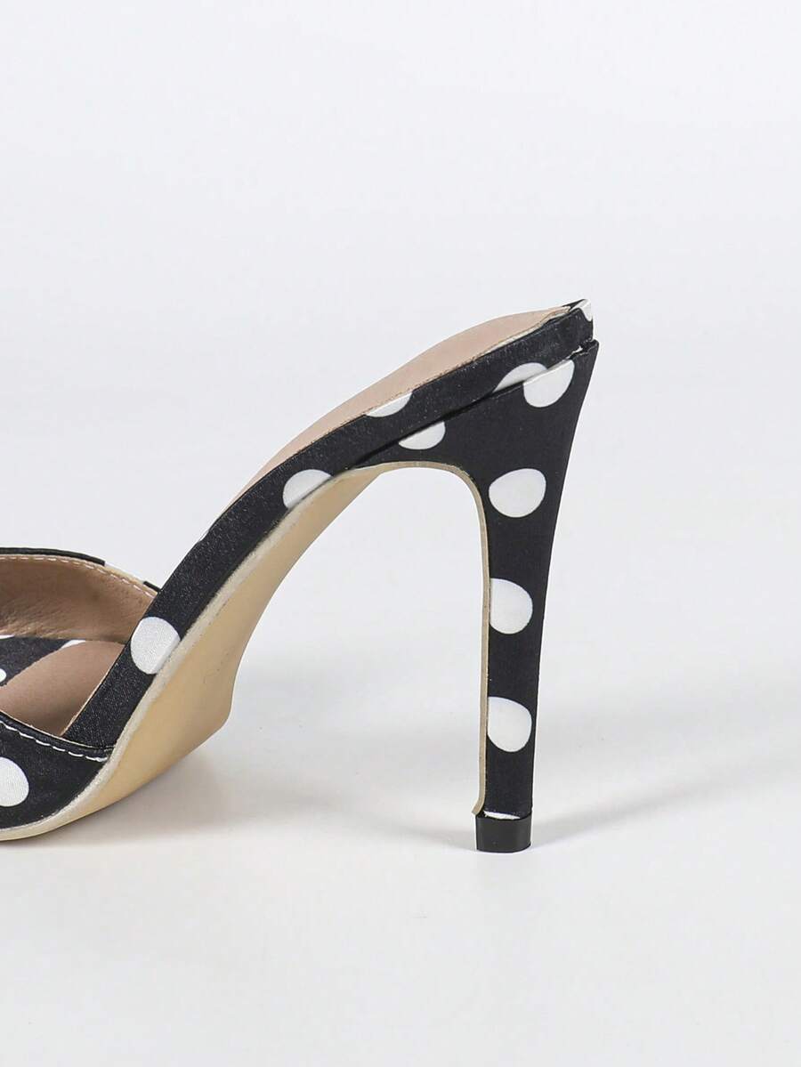 Women's black patent strap pointed toe high heel sandals featuring a stiletto heel and open hollow-out slingback design.