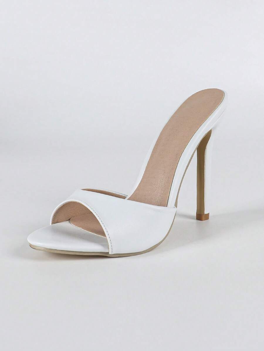 Women's open toe stiletto heel slip-on mule sandals with glossy patent leather finish and hollow-out detailing.