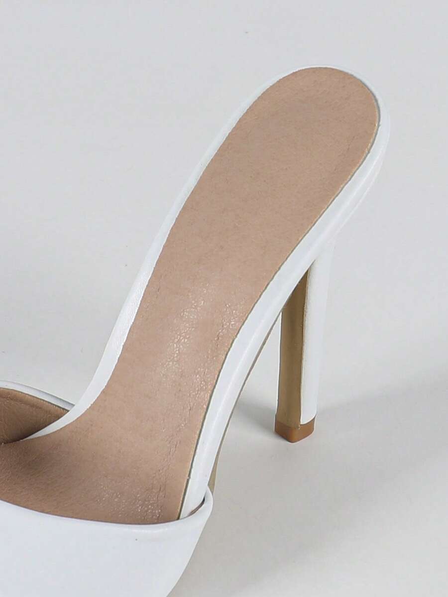 Women's black patent strap pointed toe high heel sandals featuring a stiletto heel and open hollow-out slingback design.