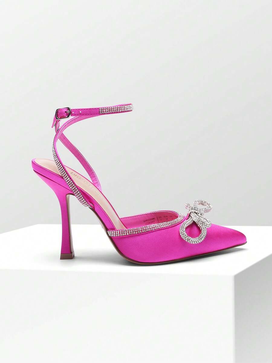 Women's rhinestone ankle strap high heels with pointed closed toe, strappy bow details, and stiletto heel for wedding and prom wear.