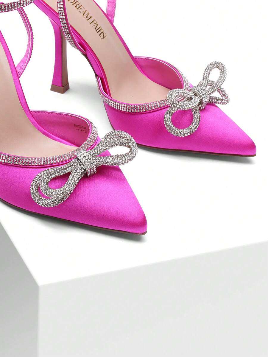 Women's rhinestone ankle strap high heels with pointed closed toe, strappy bow details, and stiletto heel for wedding and prom wear.