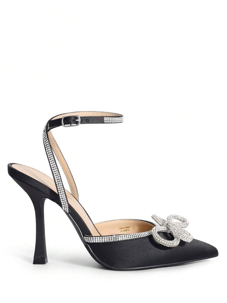 Women's rhinestone ankle strap high heels with pointed closed toe, strappy bow details, and stiletto heel for wedding and prom wear.