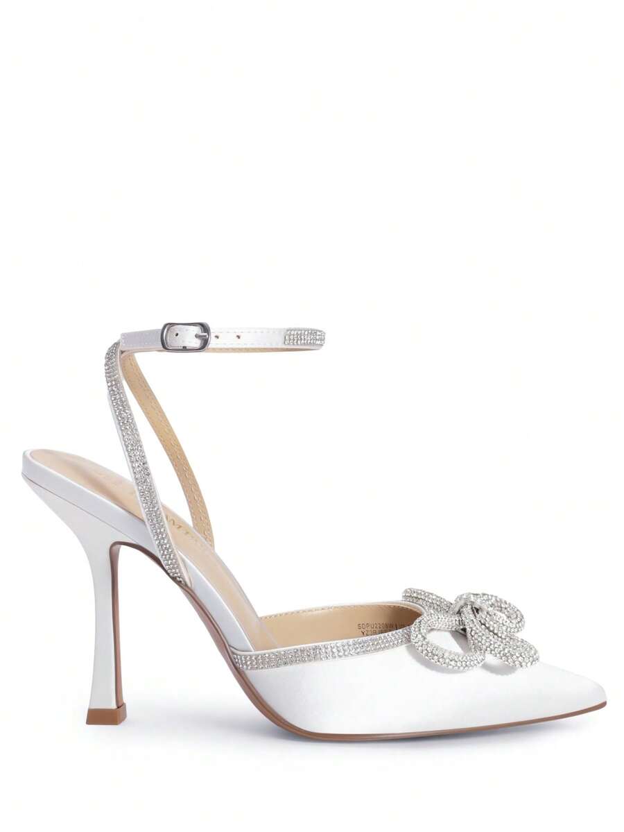 Women's rhinestone ankle strap high heels with pointed closed toe, strappy bow details, and stiletto heel for wedding and prom wear.