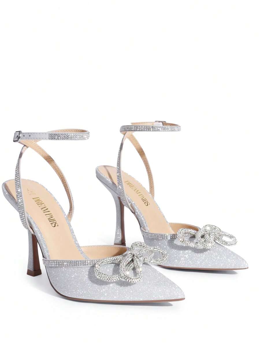 Women's rhinestone ankle strap high heels with pointed closed toe, strappy bow details, and stiletto heel for wedding and prom wear.