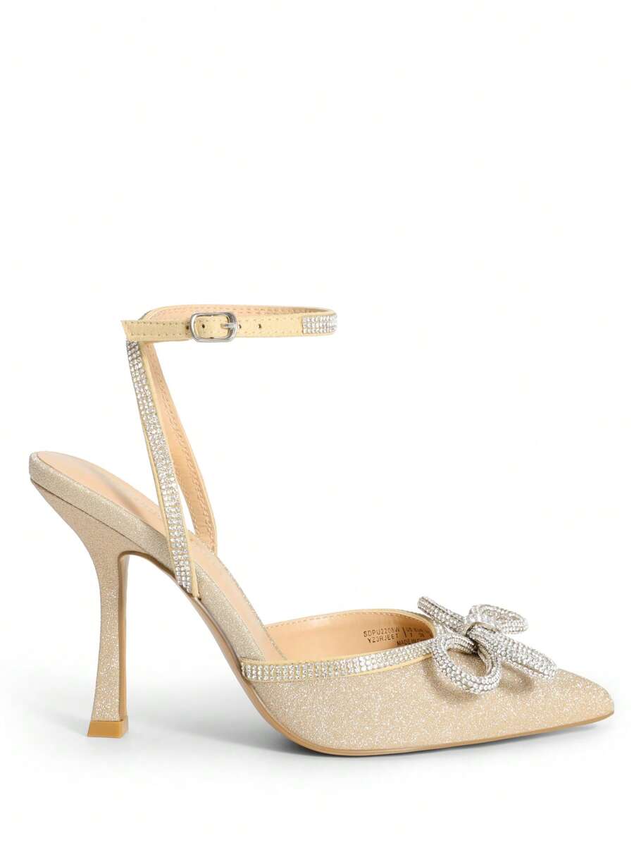Women's rhinestone ankle strap high heels with pointed closed toe, strappy bow details, and stiletto heel for wedding and prom wear.