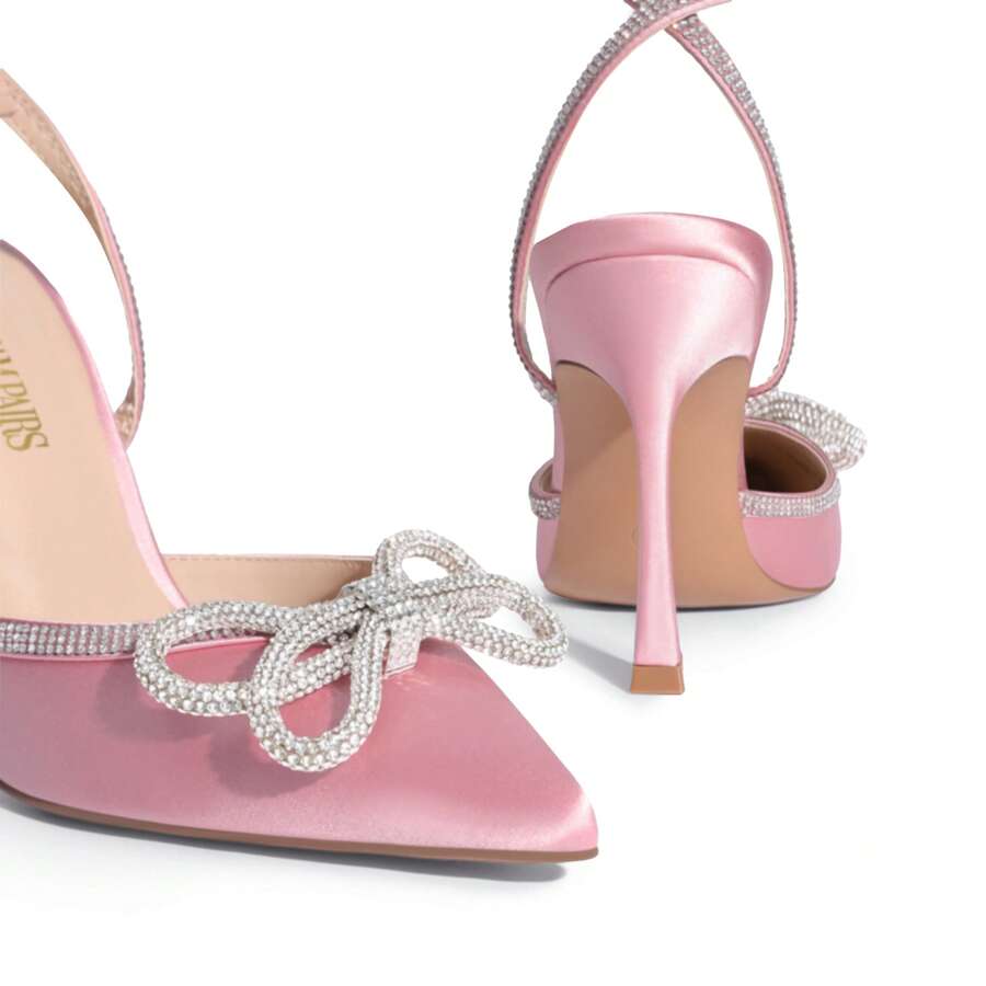 Women's rhinestone ankle strap high heels with pointed closed toe, strappy bow details, and stiletto heel for wedding and prom wear.
