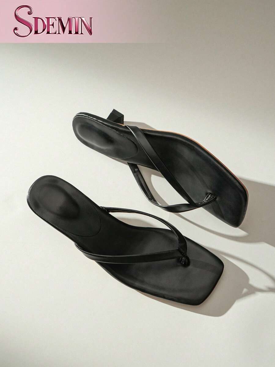 Women's slip-on kitten high heel sandals featuring a square toe and toe post thong design in solid PU leather.