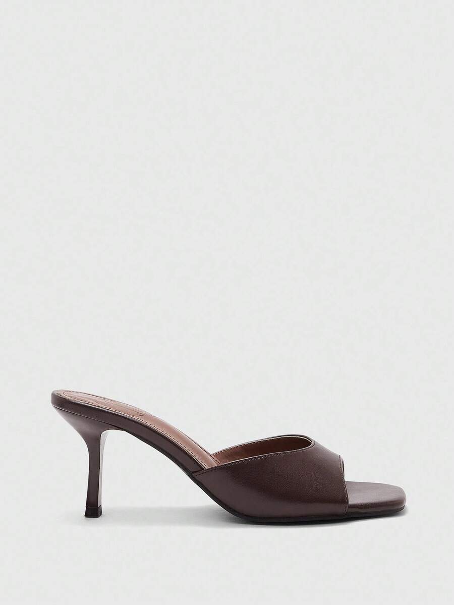 Women's black square toe high heel sandals featuring an open toe design, thin stiletto heel, and slingback strap.