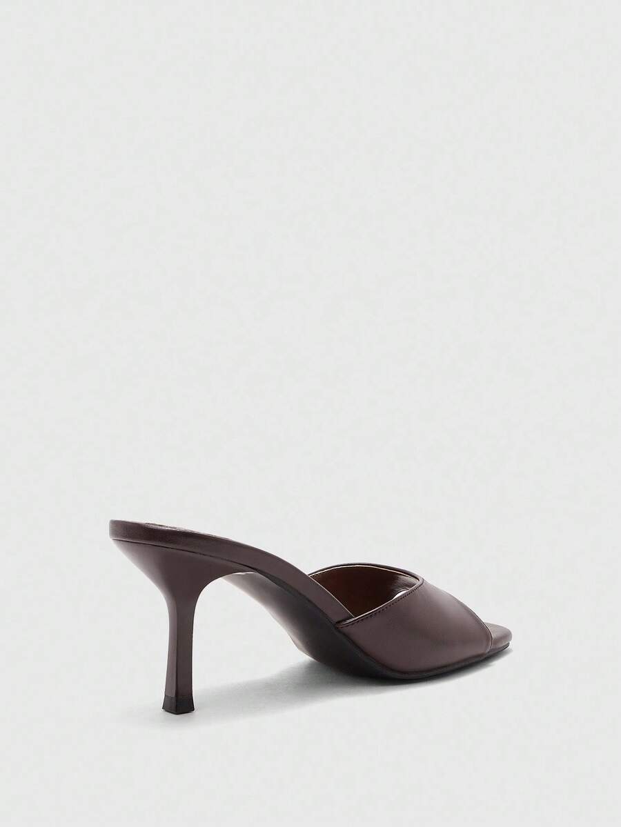 Women's black square toe high heel sandals featuring an open toe design, thin stiletto heel, and slingback strap.