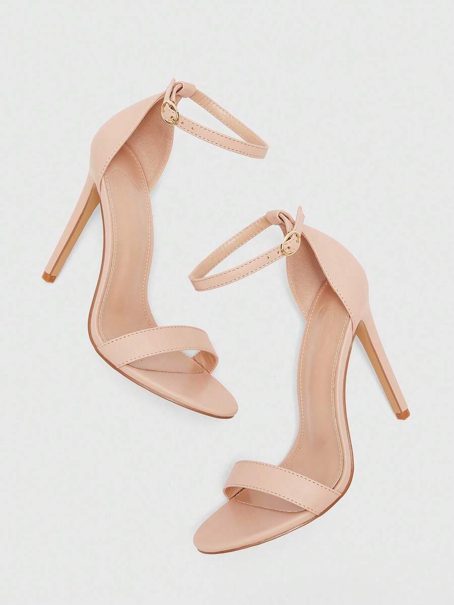 Women's stiletto sandals featuring an ankle strap buckle closure and classic round open toe design.