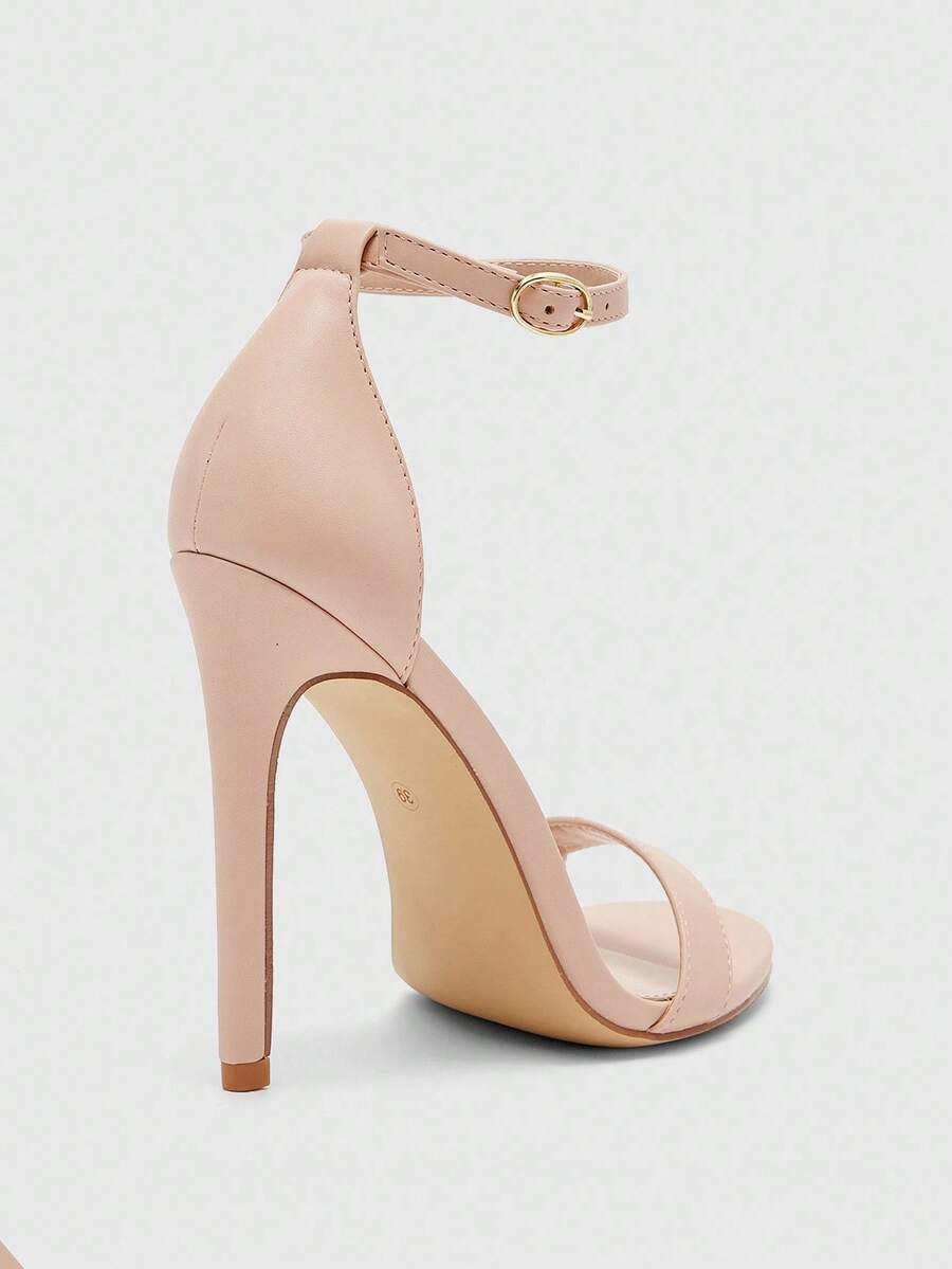 Women's stiletto sandals featuring an ankle strap buckle closure and classic round open toe design.