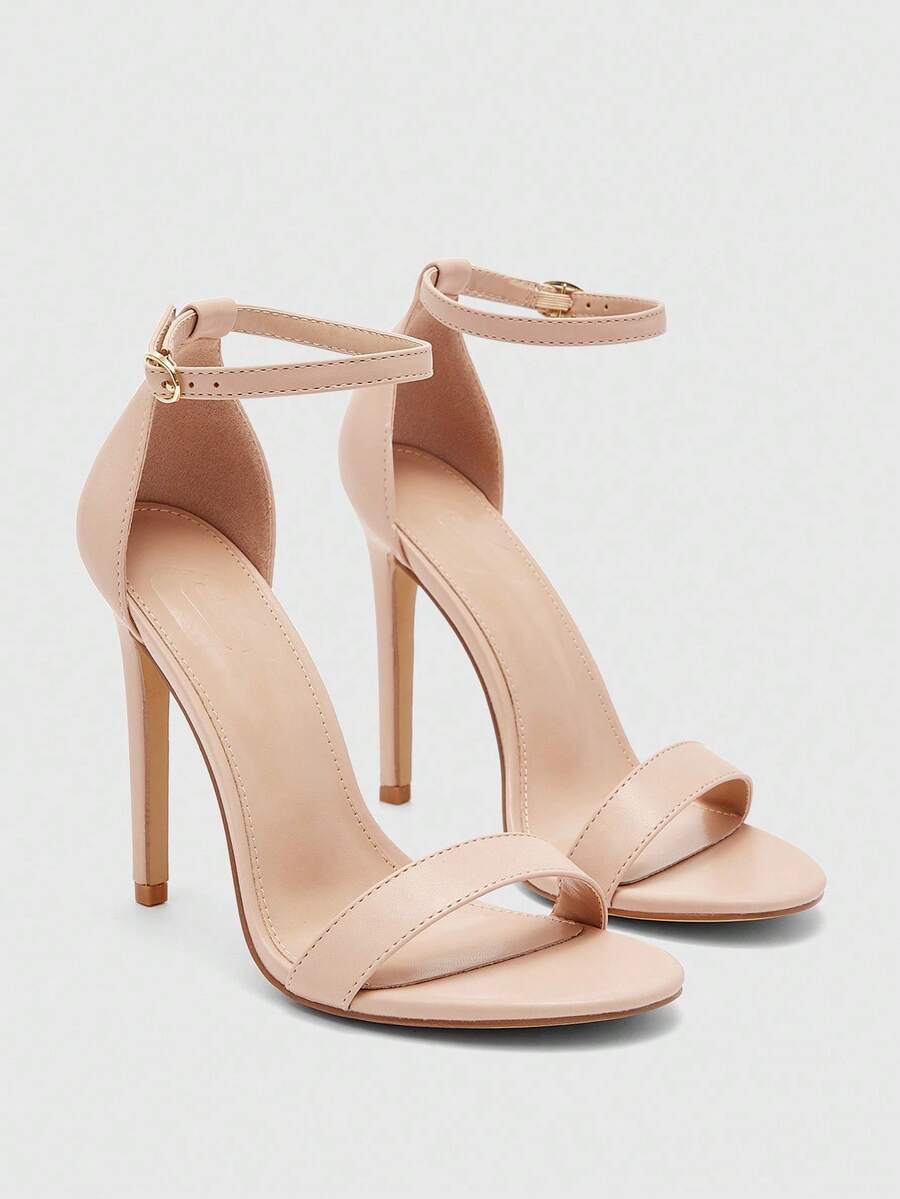 Women's stiletto sandals featuring an ankle strap buckle closure and classic round open toe design.
