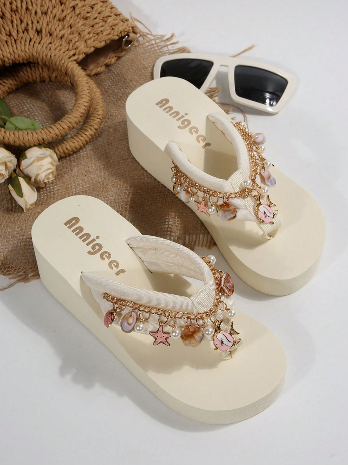 Beige platform wedge flip flop slippers featuring decorative chain and shell details with EVA sole for women.