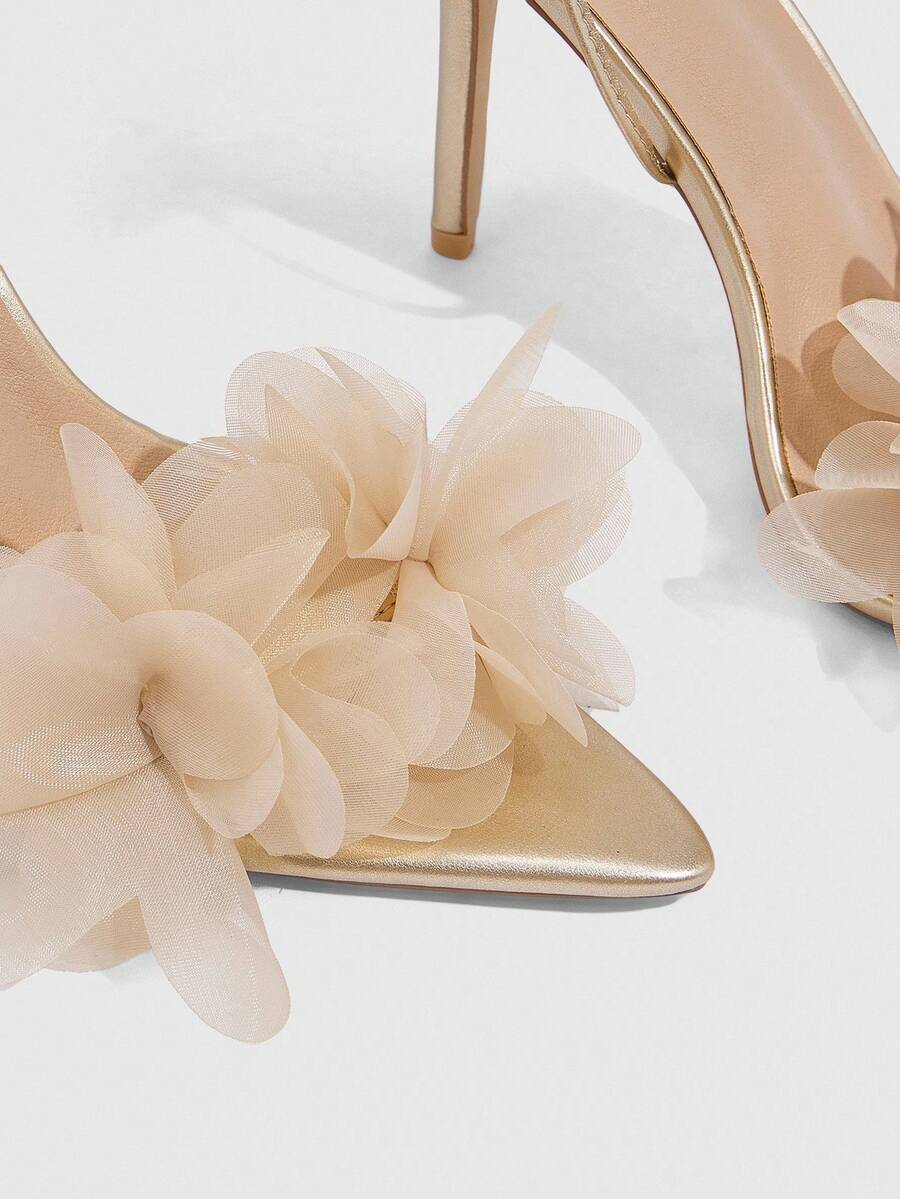 Women's open toe heeled sandals featuring 3D floral decor, satin lace-up ankle straps, and stiletto high heels.