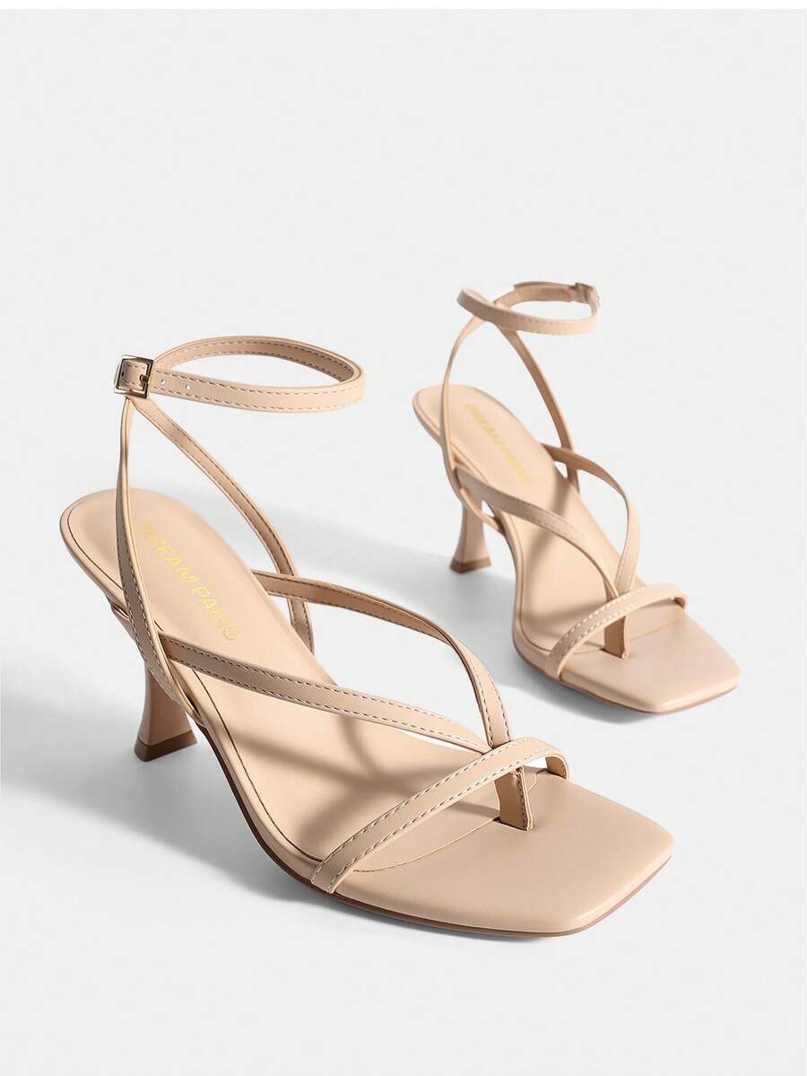 Open square toe kitten heel thong sandals with delicate cross-over straps and an adjustable ankle buckle strap.