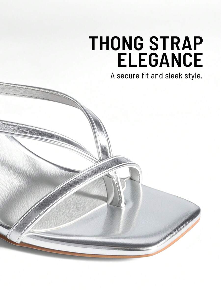 Open square toe kitten heel thong sandals with delicate cross-over straps and an adjustable ankle buckle strap.
