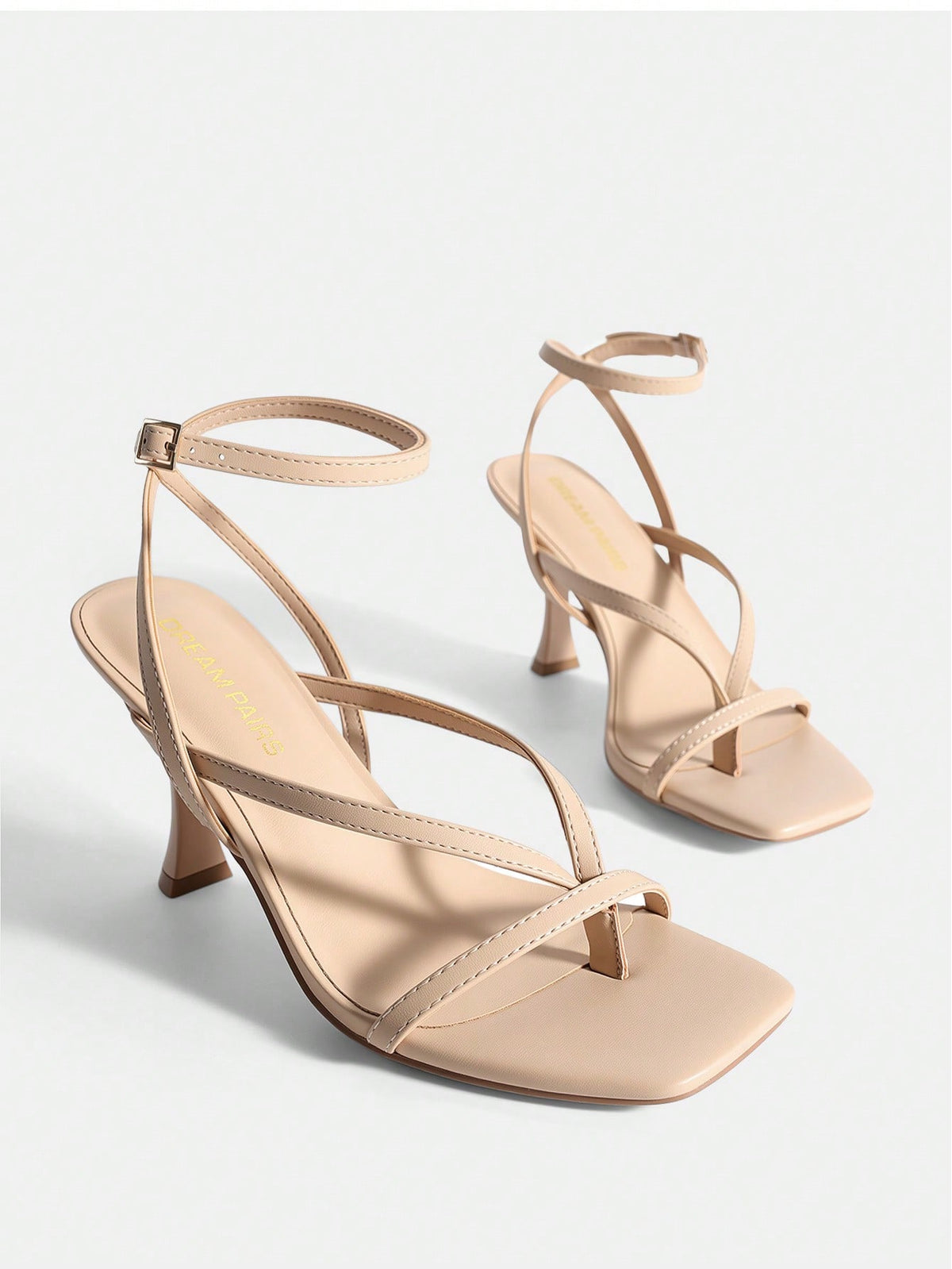 Women's metallic kitten low heel thong sandals featuring an open square toe and slip-on mule design.