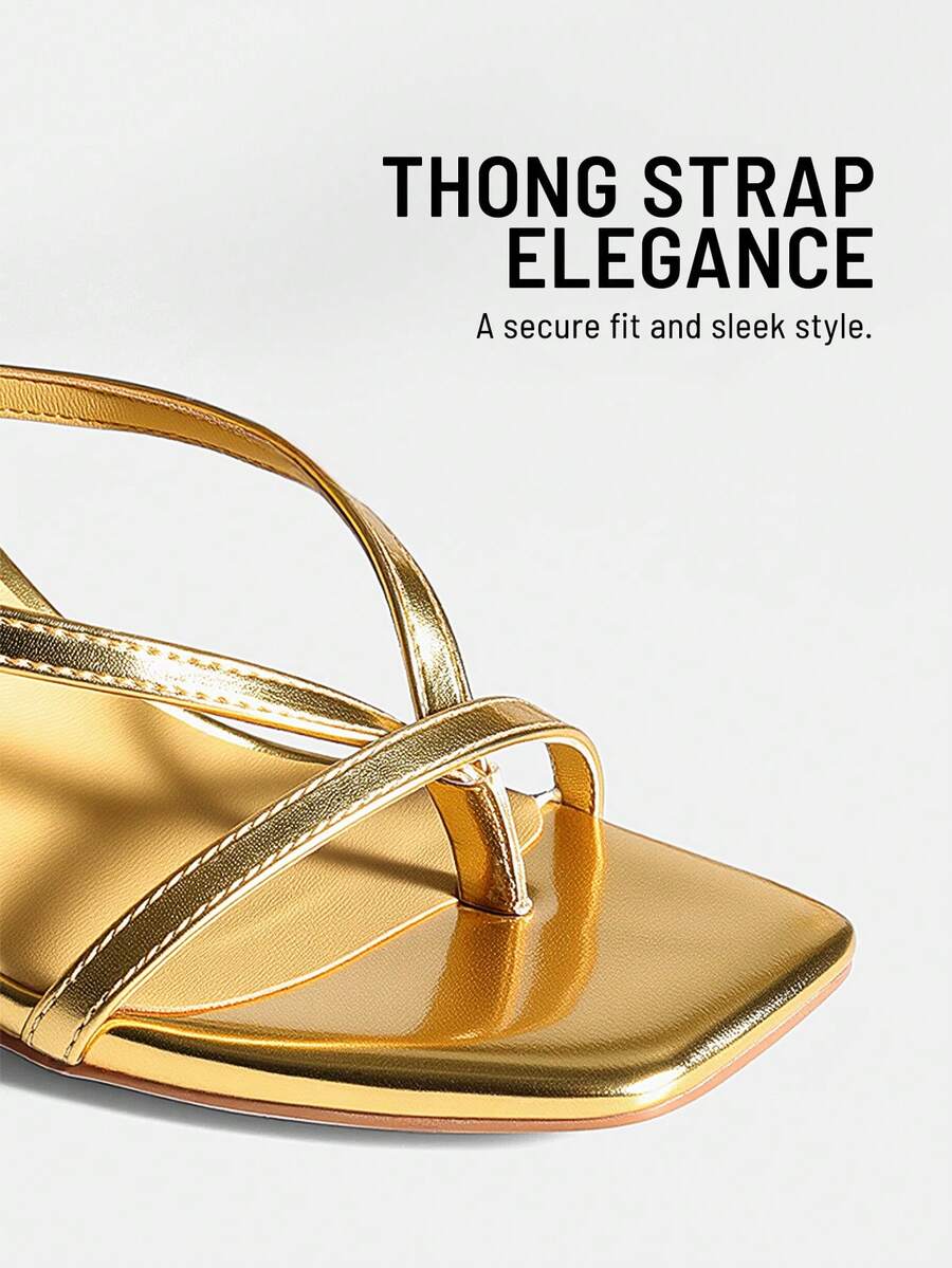 Women's metallic kitten low heel thong sandals featuring an open square toe and slip-on mule design.