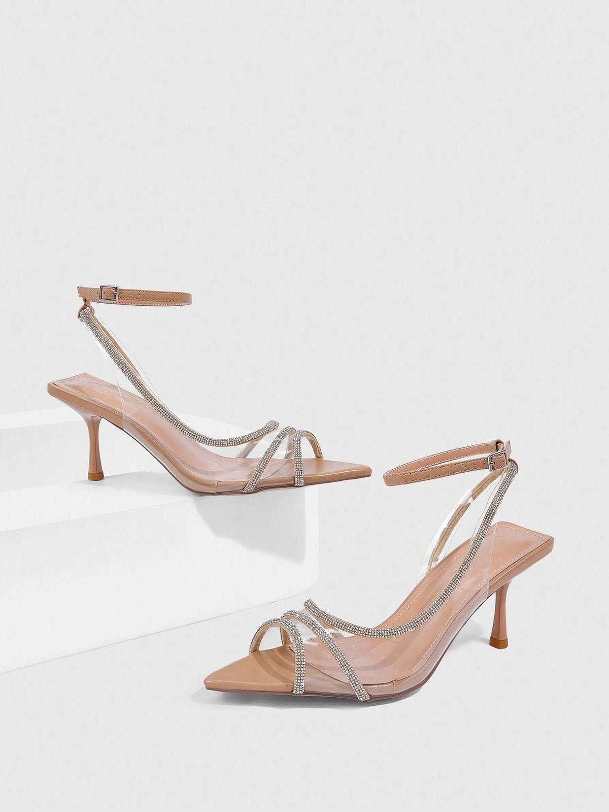 Women's gold open toe high heel sandals featuring sparkling rhinestone ankle strap and transparent upper
