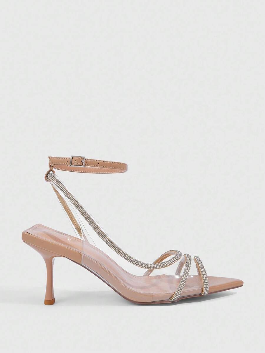 Women's gold open toe high heel sandals featuring sparkling rhinestone ankle strap and transparent upper