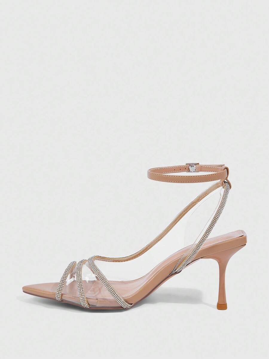 Women's gold open toe high heel sandals featuring sparkling rhinestone ankle strap and transparent upper