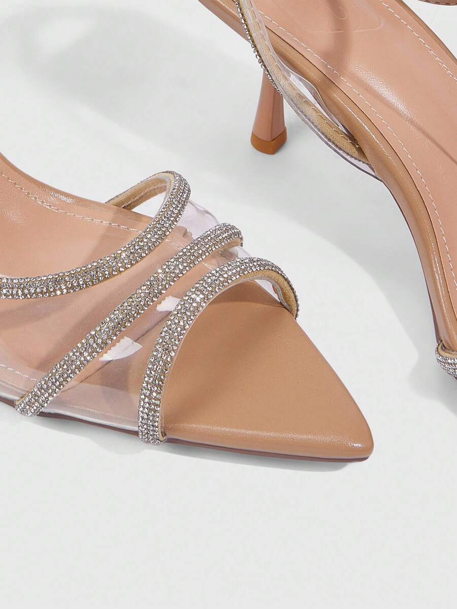 Women's gold open toe high heel sandals featuring sparkling rhinestone ankle strap and transparent upper