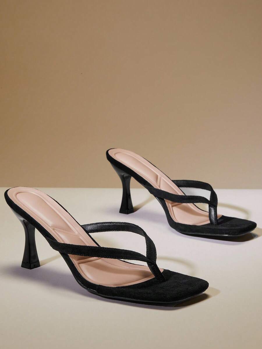 Women's square toe kitten heel thong heeled sandals featuring an asymmetrical strap design and mid heel