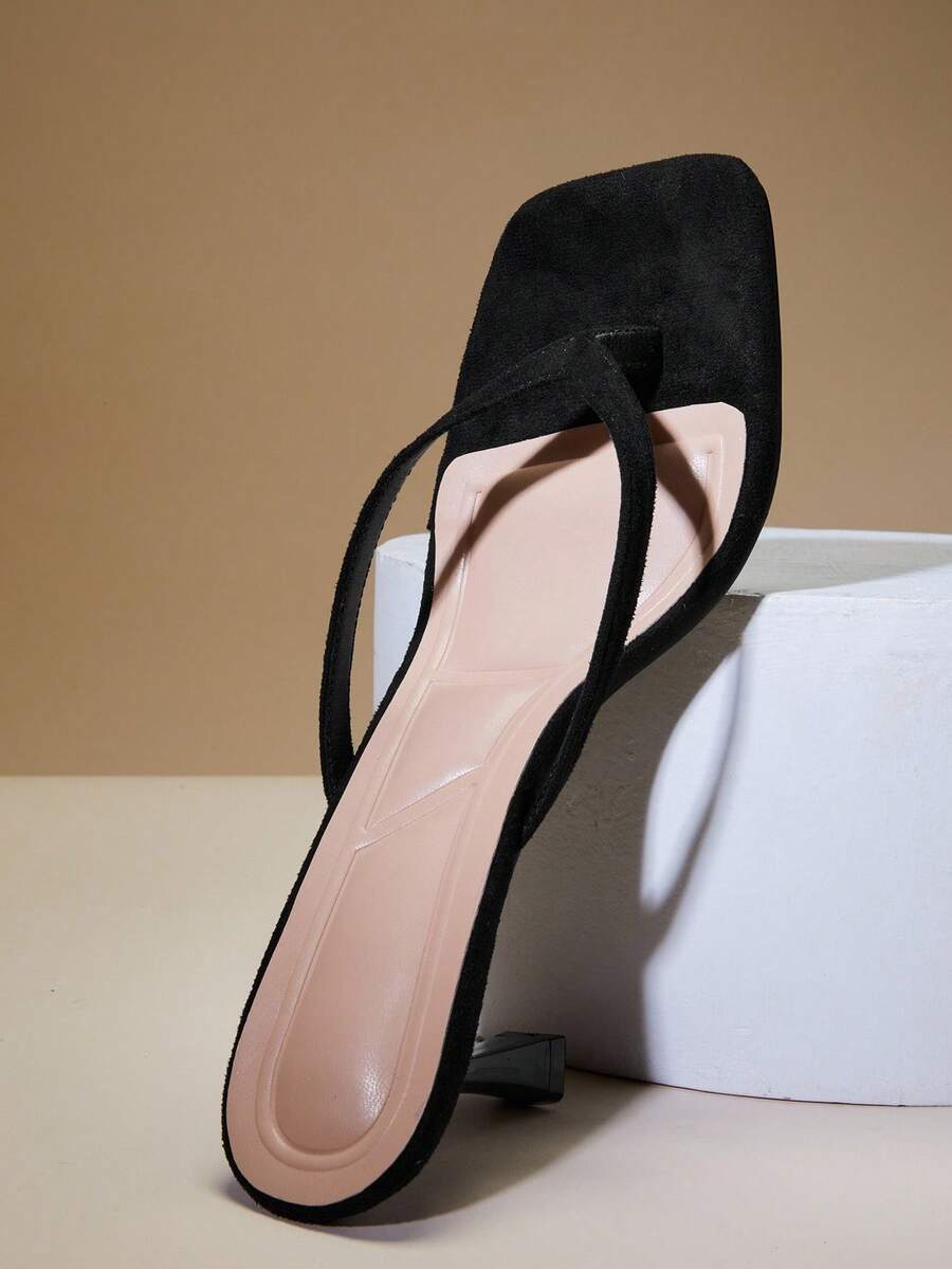 Women's square toe kitten heel thong heeled sandals featuring an asymmetrical strap design and mid heel