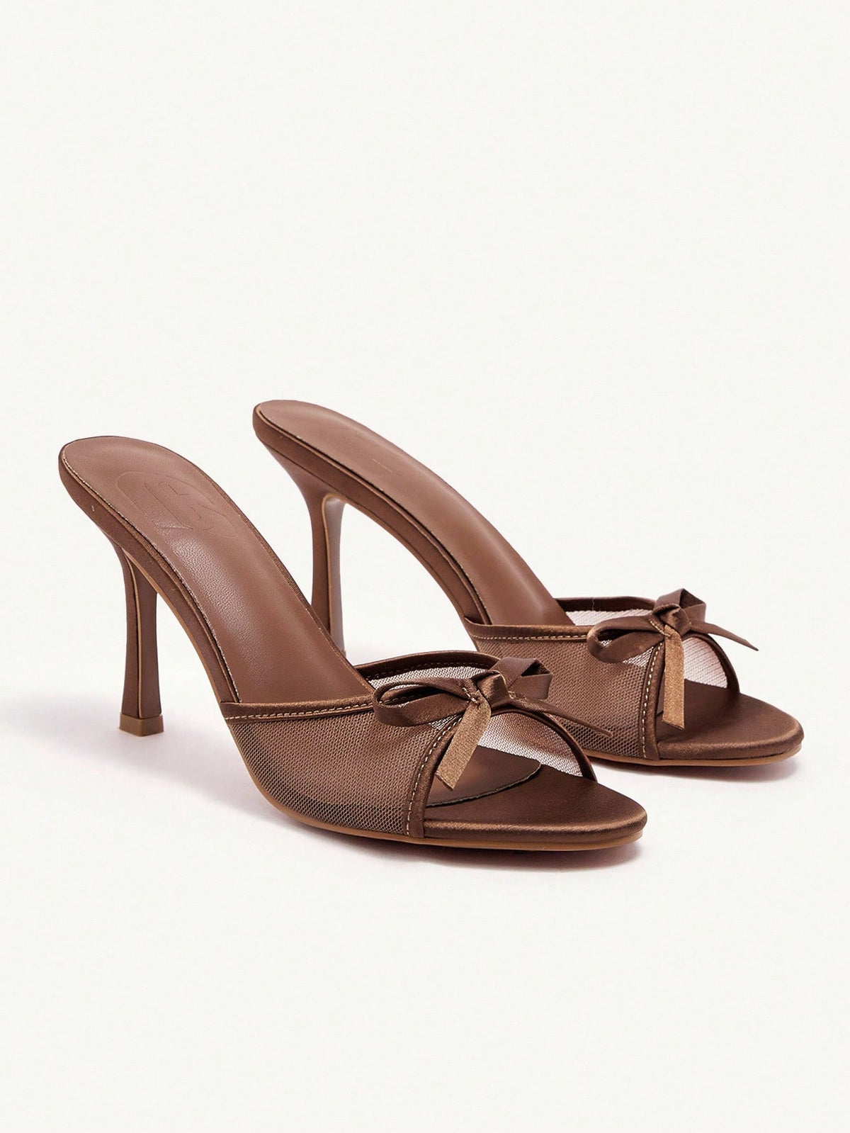 Elegant women's pointed toe high heel mules crafted from smooth PU leather with stiletto heels and delicate bow detail.